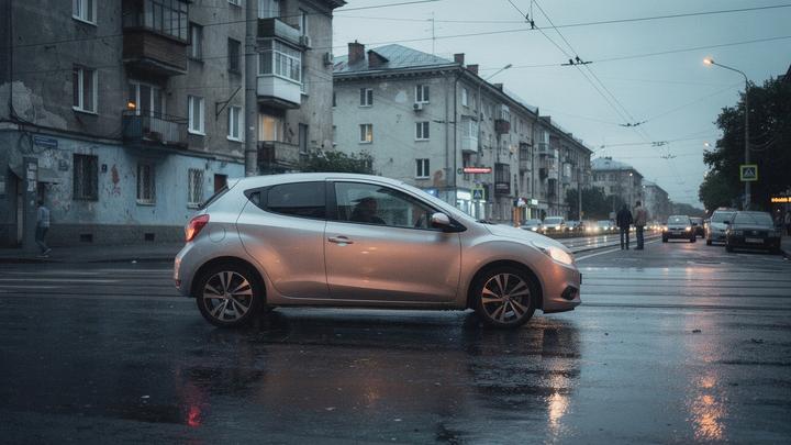 Compact silver city car parked on a Kyiv street near tram tracks